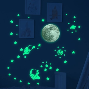 Luminous wall stickers set featuring realistic moon, astronauts, and glowing stars in space
