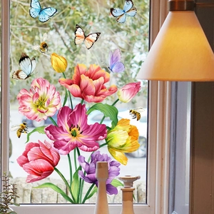 Detail of colorful tulip and butterfly static window clings on bright glass surface