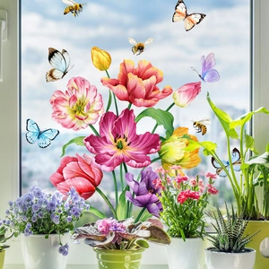 Colorful floral and butterfly static window clings on glass with bright spring sunlight