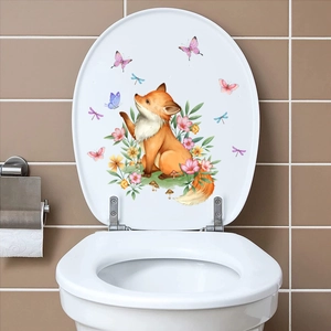 Detail of waterproof watercolor fox and floral sticker on a white toilet cover