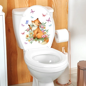 Close-up of animal wall sticker with fox and flowers on a white toilet lid