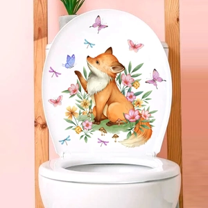 Close-up of cute fox and floral decals on a white bathroom toilet lid cover