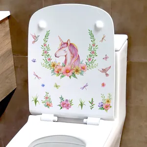 Detail view of unicorn floral waterproof sticker applied on white toilet lid in modern bathroom