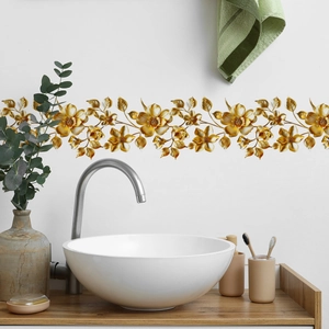 Detail of golden floral vine wall stickers with metallic texture in a modern bathroom