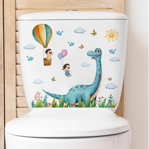 Detailed close-up of cartoon long-neck dragon and kids decals on a white ceramic toilet tank