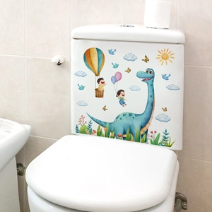 Detailed view of colorful cartoon animal decals on a white ceramic bathroom toilet tank