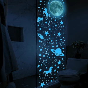 Luminous blue unicorn astronaut moon wall stickers glowing in a dark room setting