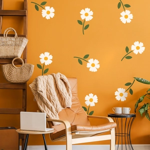 White daisy wall stickers on orange wall with bohemian living room furniture