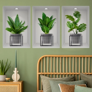 Dettaglio degli adesivi murali 3D con piante verdi in vaso e foglie di monstera