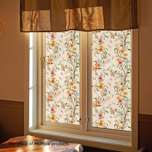 Floral window privacy film with orange blossoms and butterflies on retro wood window frame