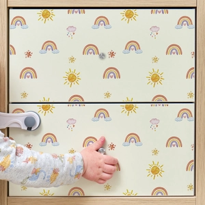 Child safety lock on rainbow cabinet prevents toddlers from opening drawers at home