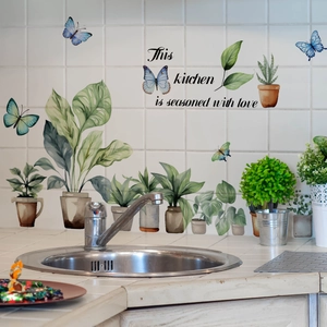 Kitchen wall decals with green potted plants, butterflies and love quote on white tiles