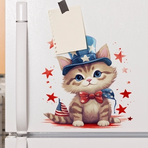 Close-up of a cartoon cat wall sticker with Independence Day hat on a white fridge