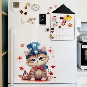 Detailed view of Independence Day cat sticker on a white refrigerator with festive decor