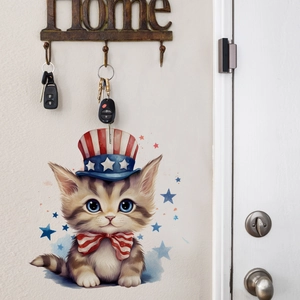 Detail of watercolor cat wall sticker with patriotic hat and blue star decorations