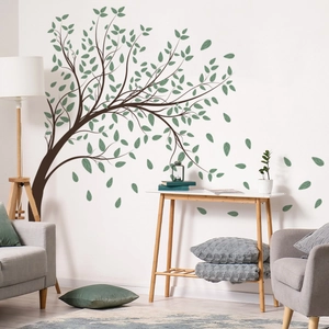 Detail of minimalist green leaf tree wall stickers applied to a modern living room wall