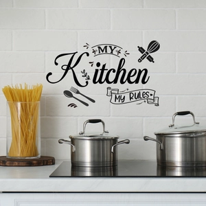 Detail of My Kitchen My Rules wall decal with cooking utensils on a brick wall