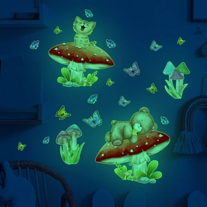 Luminous wall stickers showing a glowing bear, cat, and mushroom in a dark nursery room