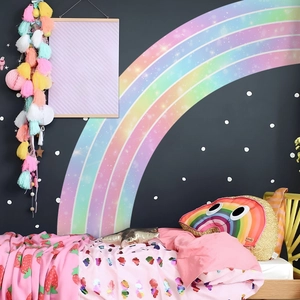 Large colorful rainbow wall stickers with white dots and stars for a girl bedroom