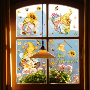 Bee Festival window clings featuring gnomes and sunflowers on a glass window