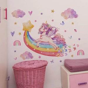 Detail of glow-in-the-dark unicorn wall stickers with rainbow, stars and butterflies decor