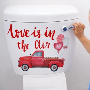 Detail of red vintage truck toilet sticker with heart balloons and Love is in the air text