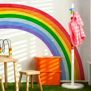 Large rainbow wall decal for kids bedroom decor featuring vibrant colorful arched stripes