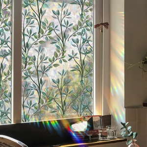 Retro green plant vine window film with decorative mosaic texture and rainbow prism effect