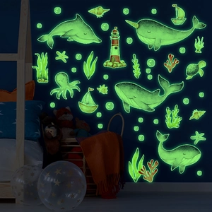 Luminous ocean whales and sea life wall stickers set glowing in a dark blue kids room