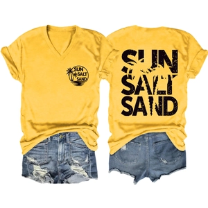 Detail of yellow V-neck Sun Salt Sand T-shirt with palm trees and denim shorts