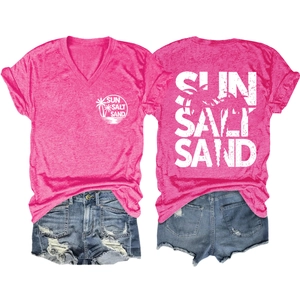 Detail of pink V-neck t-shirt with Sun Salt Sand print and denim shorts set