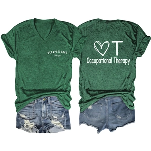 Flat lay of green V-neck Occupational Therapy shirt with distressed denim shorts