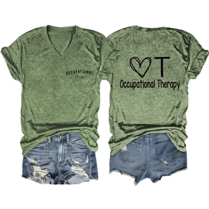 Flat lay of green Occupational Therapy V-neck T-shirt paired with ripped denim shorts