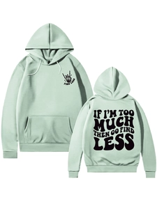 Detail of mint green hoodie featuring front and back bold black slogan graphic prints