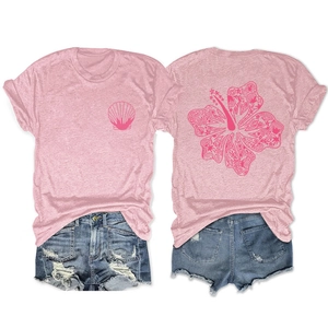 Detail of pink floral t-shirt back print with shell elements and distressed denim shorts