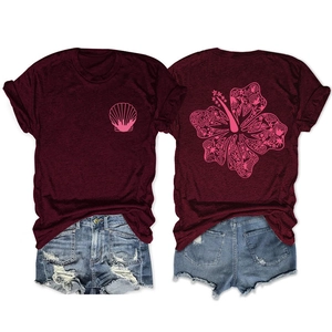 Detail of burgundy T-shirt showing front shell print and back tropical flower design