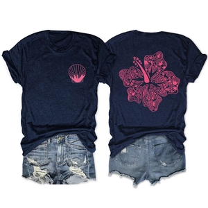 Front and back view of navy blue T-shirt with pink hibiscus print and denim shorts