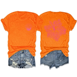 Front and back view of vibrant orange T-shirt with shell print and denim shorts set