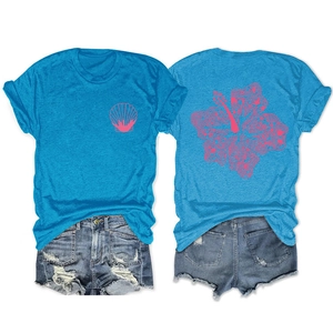 Detail showing bright blue T-shirt with pink hibiscus print and frayed denim shorts