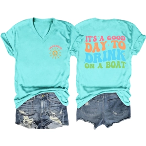 Detail of light blue V-neck t-shirt and denim shorts with 'Lake Days' graphic print