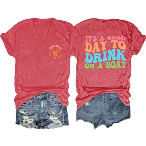 Detail view of red V-neck T-shirt with Lake Days print and distressed denim shorts