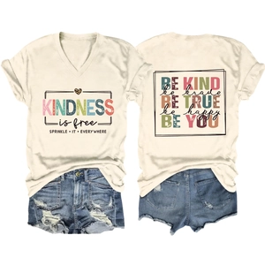 Detail of V-neck T-shirt with kindness typography and frayed hem denim shorts