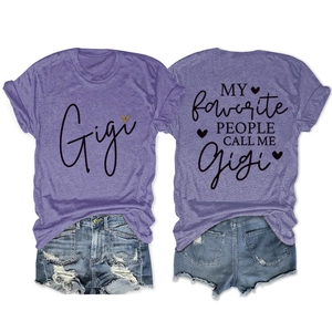 Flat lay detail of Gigi printed purple T-shirt and distressed denim shorts set