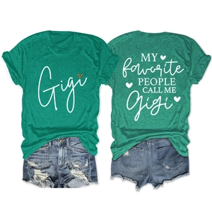 Detail view of green Gigi t-shirt with leopard heart print and denim shorts set