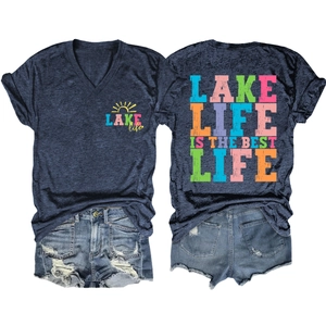 Macro detail of V-neck T-shirt with lake life print and distressed denim shorts