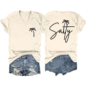 Detail of salty coconut tree print on back of white V-neck t-shirt with denim shorts