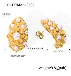 Detail of 2.5cm gold-plated titanium steel earrings featuring clustered imitation pearls