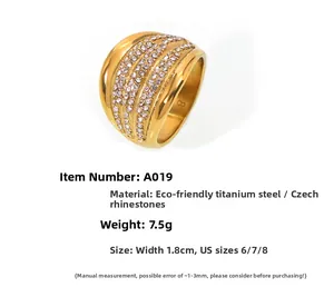 Macro detail of gold multi-layer wide ring with pavé crystals and 1.8cm width specs