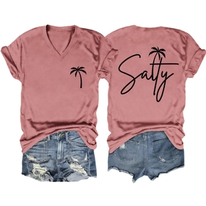 Detailed view of pink V-neck T-shirt with Salty palm tree print and denim shorts