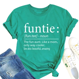 Flat lay of peacock green T-shirt with graphic print, denim jeans and white sneakers